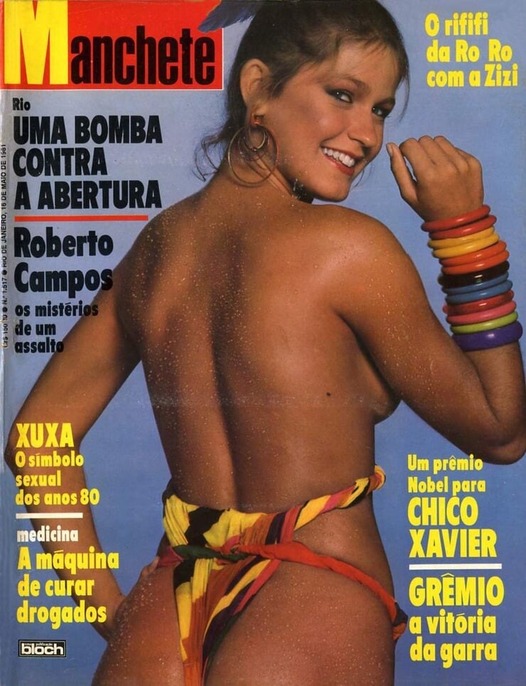 Capa da revista Manchetedos anos 80 com foto de Xuxa (de costas) de biquíni, e chamadas para reportagens sobre agitação política, assalto a um ministro, uma cura para toxicômanos, um caso lésbico entre celebridades, e um prêmio para o médium Chico Xavier