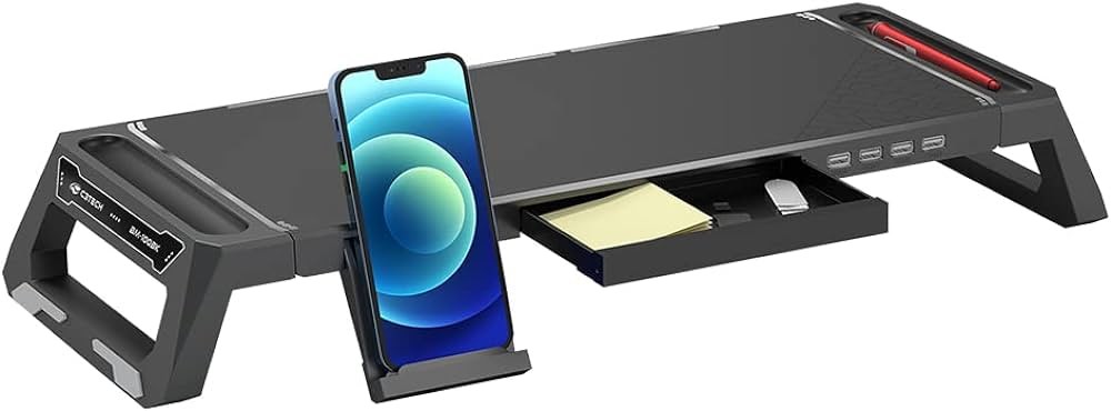 Base para monitor, com a gavetinha aberta e um celular no suporte anexo a ela
