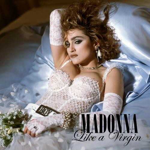 Madonna, com figurino que fica entre os conceitos de lingerie e de noiva, na capa de Like a Virgin.