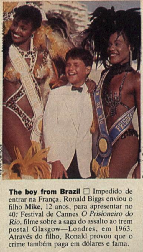 Nota da Veja com foto de Mike em traje de gala, e o texto: Impedido de entrar na França, Ronald Biggs enviou o filho Mike, 12 anos, para apresentar no 40º Festival de Cannes ‘O Prisioneiro do Rio’, filme sobre a saga do assalto ao trem postal Glasgow-Londres, em 1963. Através do filho, Ronald provou que o crime também paga em dólares e fama.