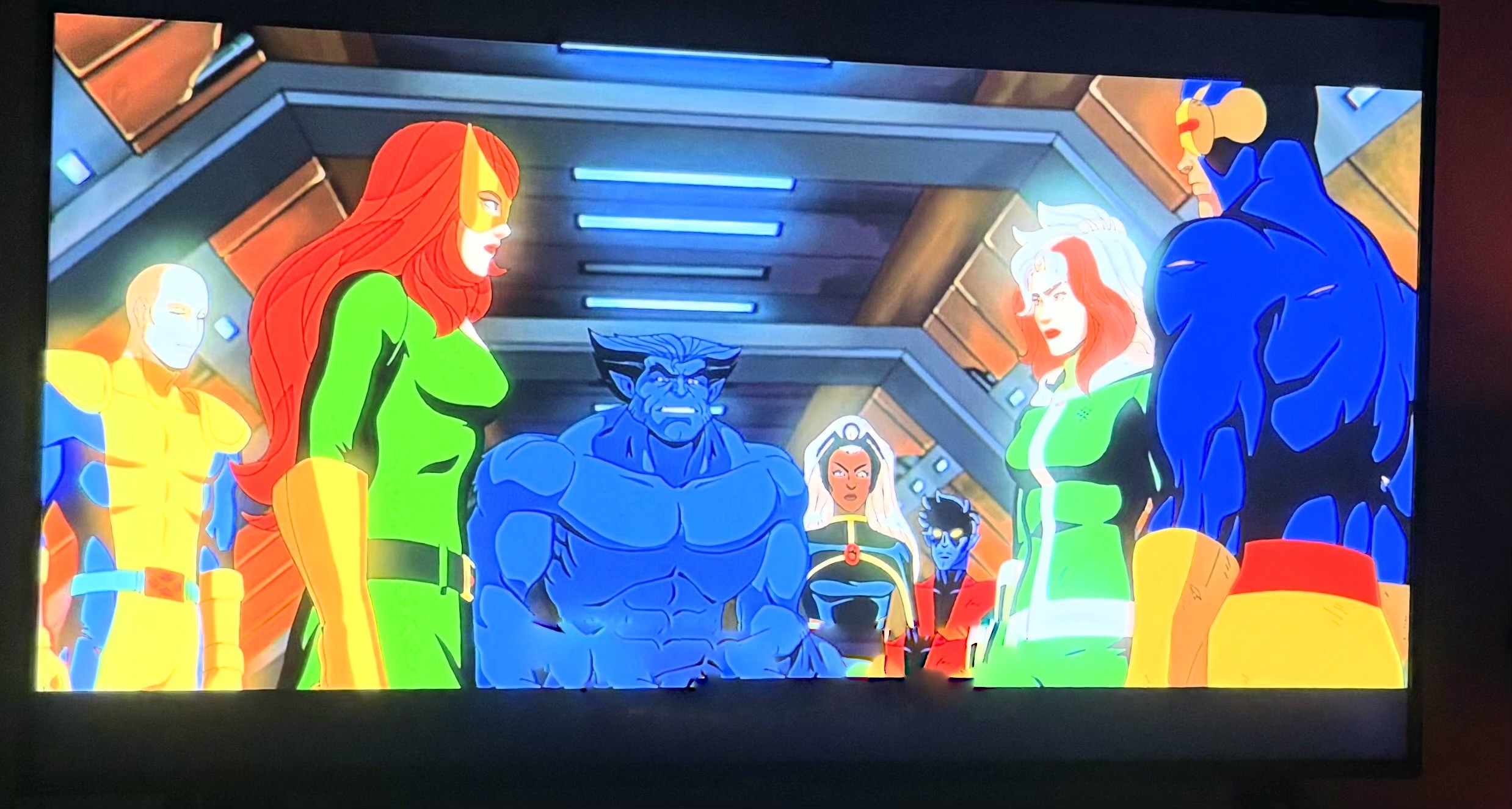 Frame do desenho animado com vários dos X-Men dos anos 80, incluindo Jean Grey, Tempestade, Fera, Noturno, Rogue e Ciclope